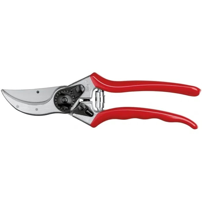Red and silver pruning shears with curved blade and ergonomic handles on white background
